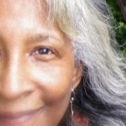 Close-up selfie of a woman smiling.