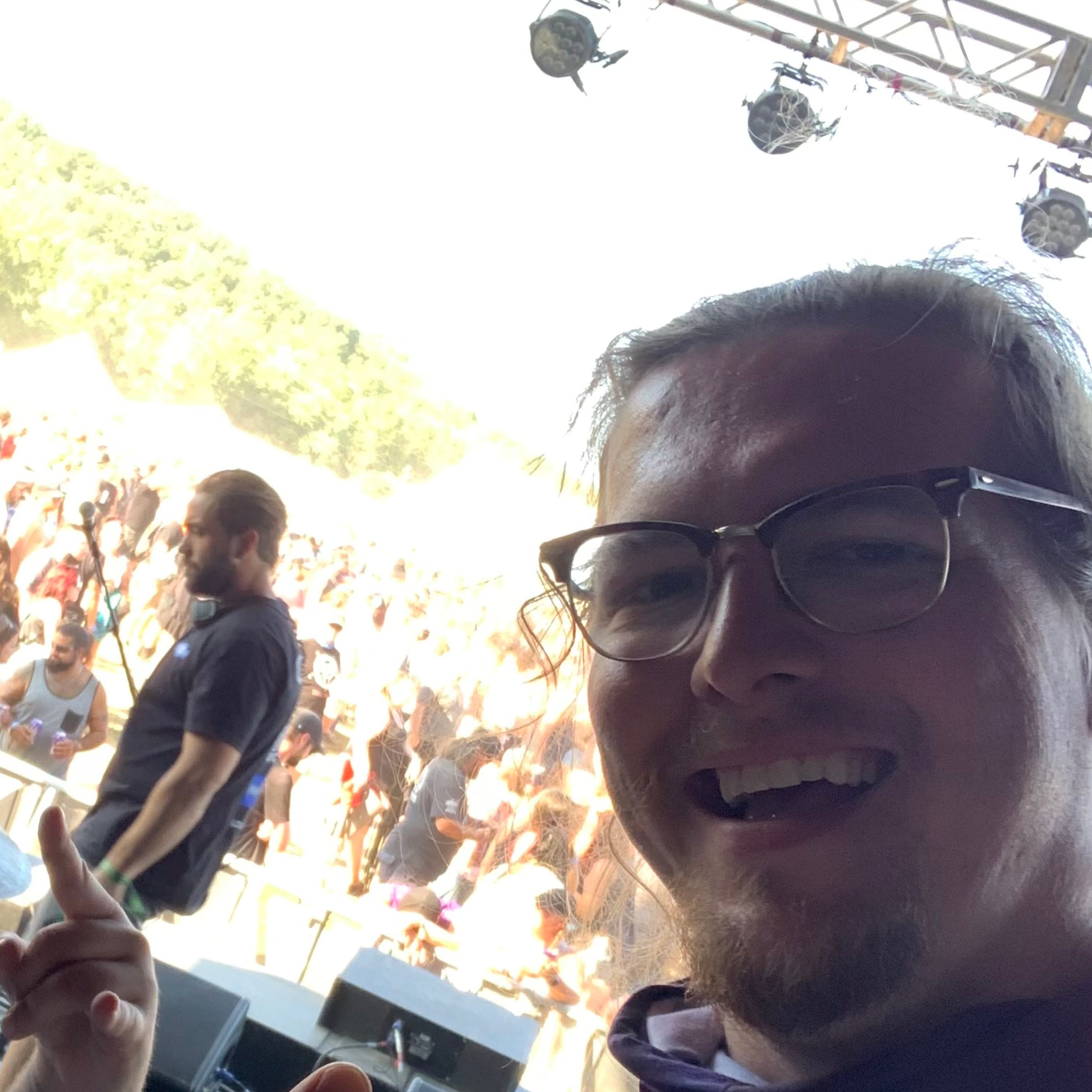 Man on stage taking a selfie