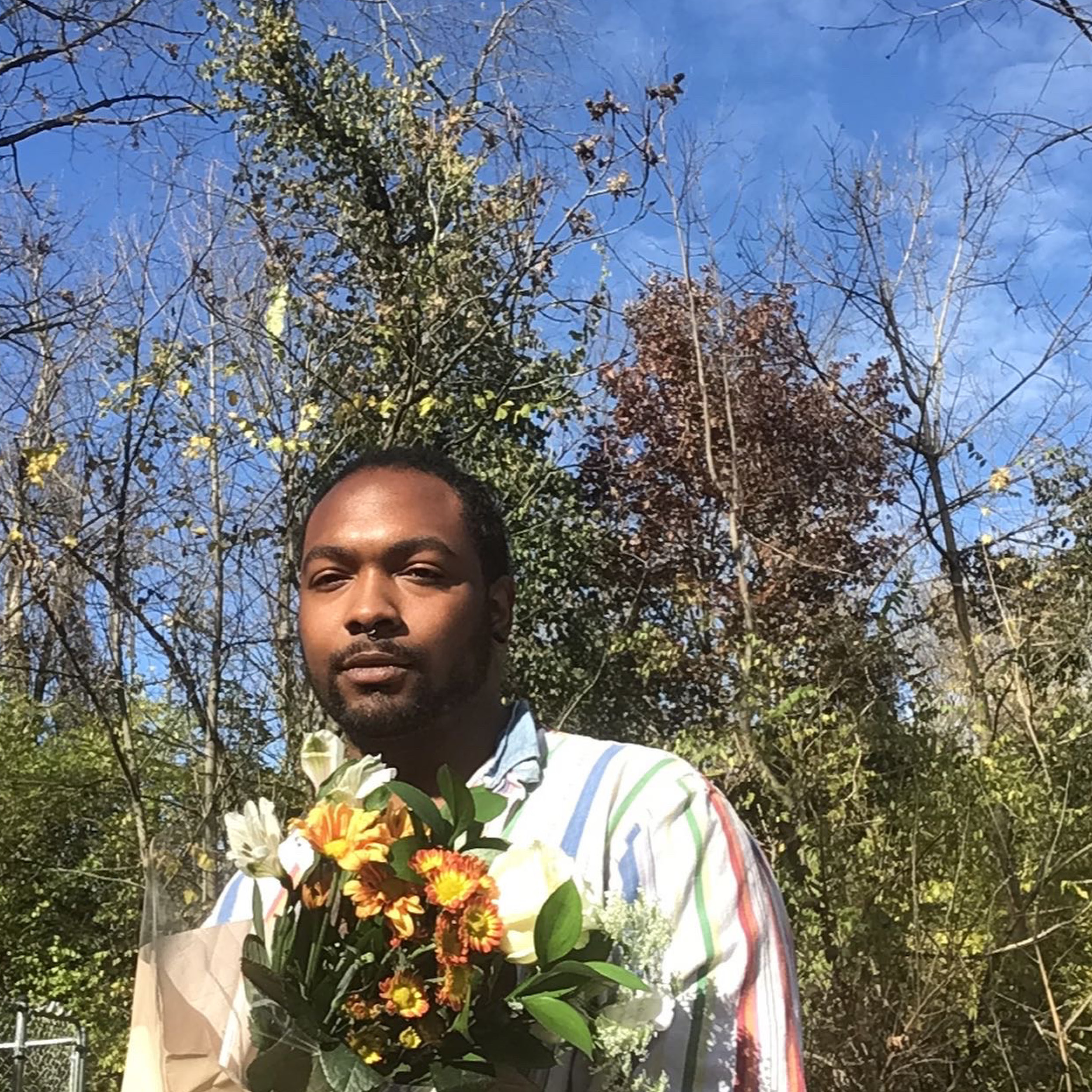 Man outside with flowers