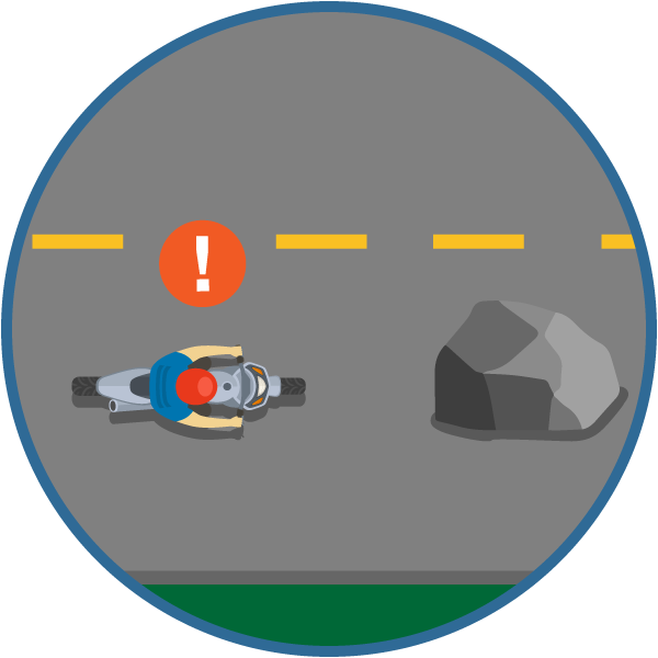 Motorcyclist driving toward an object in the road