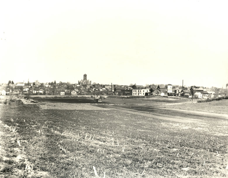 Albion Skyline, viewed north from River Road, circa 1900. Visible are Atwood Buggy Factory near railroad tracks, United Brethren Church, Presbyterian Church steeple, Old Jail, Courthouse, Methodist Episcopalian Church and Albion School.