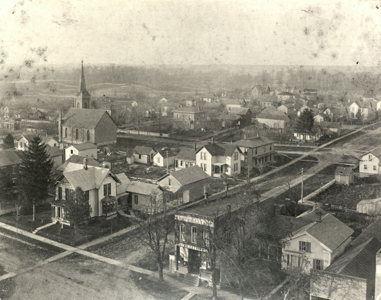 Northwest view from Courthouse tower, circa 1900. Visible are homes of early, the Presbyterian Church and the corner office of the Democrat newspaper.