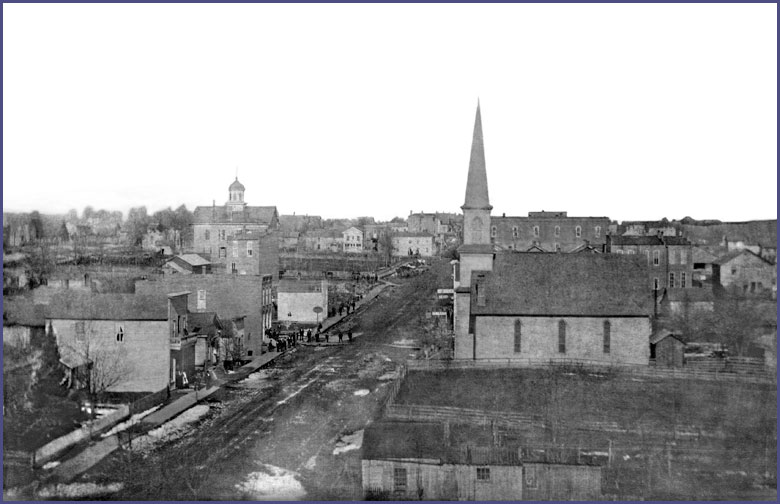 Photo from 1878 of second Courthouse and Methodist Church as seen looking from the south.