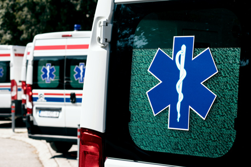 Row of ambulances with EMS symbols