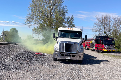 Leaking tanker truck and fire truck during exercise