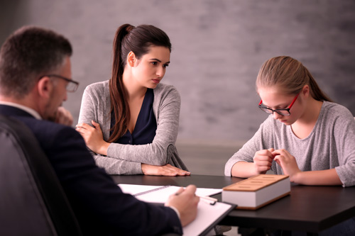 Principal meeting with parent and student who is in trouble