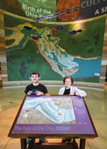 Mandie Creed and her son Dylan at Falls of the Ohio. He uses the app she developed to interact with the exhibits at the state park’s interpretive center in Clarksville.