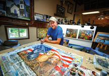 Anthony Padgett works on a painting inside his studio, a renovated barn originally built in 1853, at his Hamilton County home.