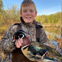 Boy holding duck