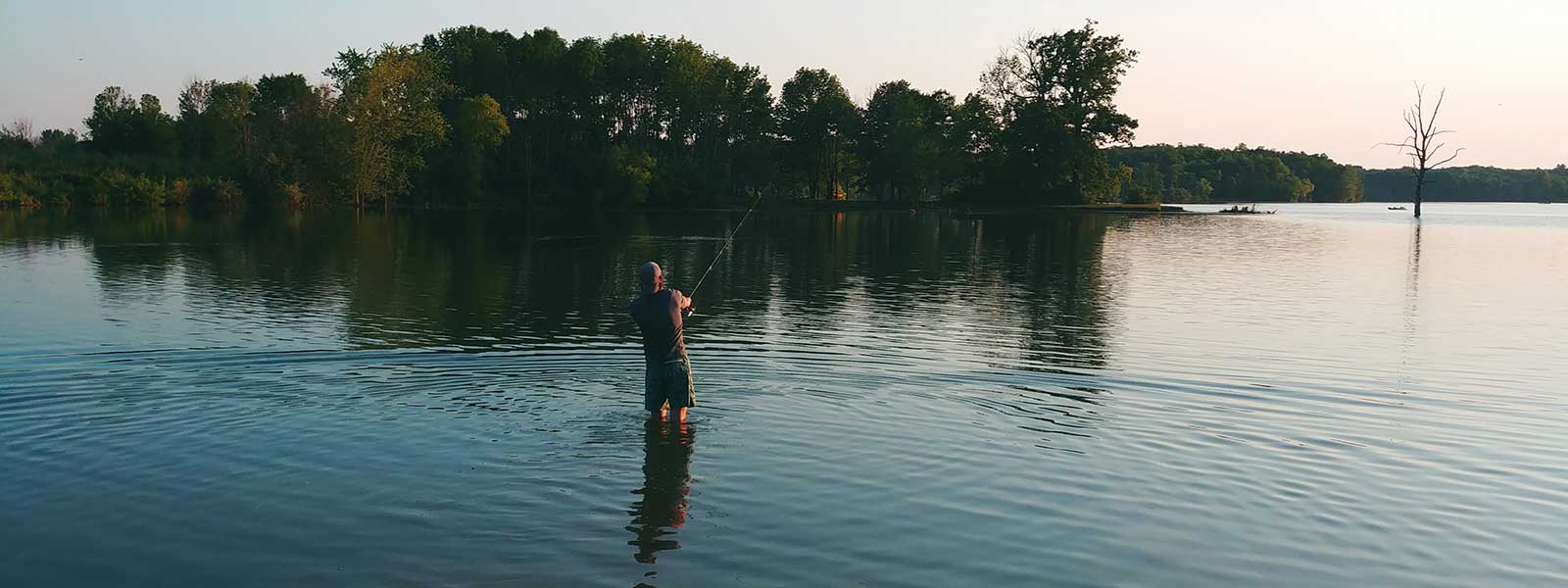 Person fishing at lake