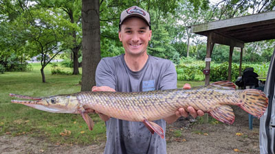 Man holding long fish