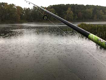 Rainy day fishing on lake