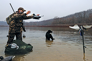 Man with waterfowl decoy