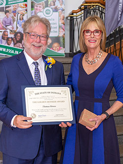 Picture of Thomas Hirons receiving the award from the Lieutenant Governor