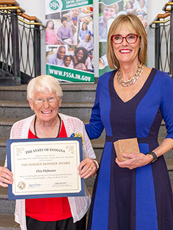 Picture of Elsie Hofmann receiving the award from the Lieutenant Governor