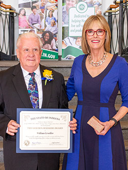 Picture of William Lewellen receiving the award from the Lieutenant Governor