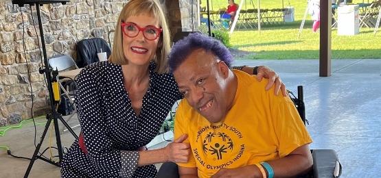 Former Lieutenant Governor of Indiana Susan Crouch with man in a wheelchair.
