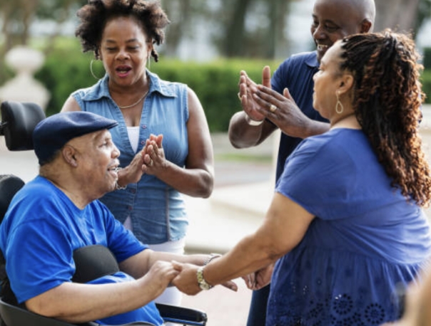 Group of people outside celebrating.