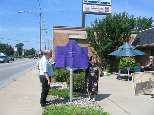 The C. G. Conn Company marker stands at the NW corner of Jackson Blvd. and Elkhart Avenue in Elkhart.