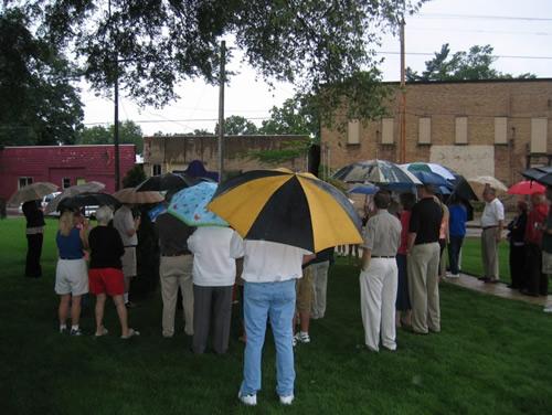 Despite the weather, about forty people attended the dedication ceremony.