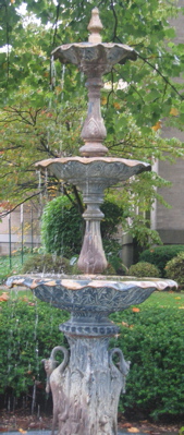 One of the two tall crane fountains that adorn the front lawn of the library.