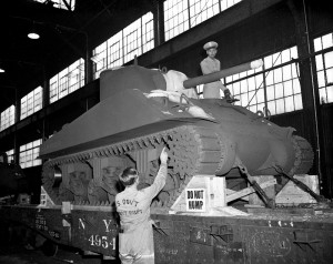 Carefully loading the M-4 Tank onto a rail car.