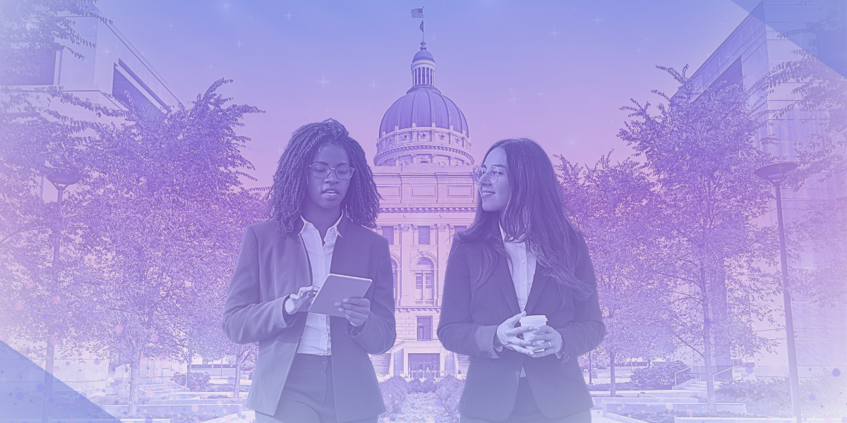 Pink/Purple edited image of two women walking infront of Indiana State Capital