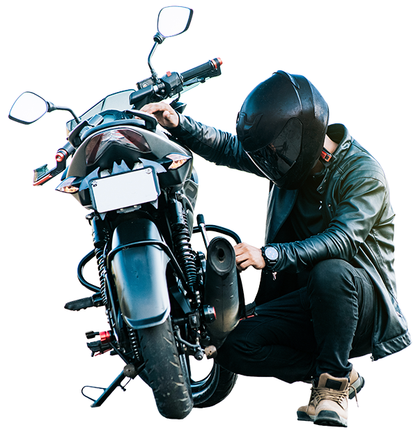 Motorcycle rider checking his bike before riding