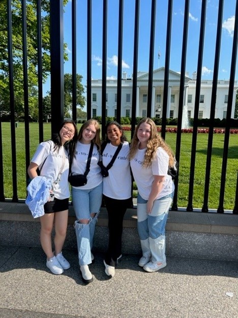 Group posed in front of white house